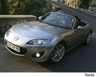 Base MSRP: $28,950 Invoice: $27,364 Fuel Economy: 21 mpg City, 28 mpg Highway  Woe is the state of the classic American convertible. Sales of droptops staggered to a low of 1 percent of the entire market last year. Analysts started predicting that someday, perhaps soon, convertibles may become extinct.  TheMazda MX-5 is a delicious exception. Sales are up nearly 10 percent this year, perhaps for the simple reason that Americans again have a little spare cash to afford an impractical purchase like this stunning little roadster. And the fact that it’s not too big a chunk of change makes it all the more appealing.  For less than $30,000, you can own one of the best sports cars on the planet. Forget about the power and brawn on the Ford Mustang and Chevy Camaro, the Miata will make you feel like you’re driving a car for the very first time. Its driving dynamics and I-4 engine make it a joyful companion for any road trip.  You can buy the base model for less than $25,000. But go ahead and spend a little extra on the electric-powered electric hardtop. Not only will motorists appreciate the ease in dropping the top, but the hard top will make the MX-5 a little more practical.  Research the Mazda MX-5 Miata Mazda MX-5 Miata Photos & Information Mazda MX-5 Miata Best Deals Mazda MX-5 Miata Local Dealer Price Quote