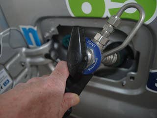 No one likes something different, and filling up with CNG is different. The nozzle has to lock onto the tank, which is a small nozzle right next to the gas tank cap. Then, when you pull down the handle, there's a big whooshing sound that surprised me.  Other than that, it was absolutely normal. And that's one reason America could convert to CNG so quickly.  Fill-up time is only a few minutes and process. Walk in, tell the cashier you want to fill up on pump 15 and then whoosh.