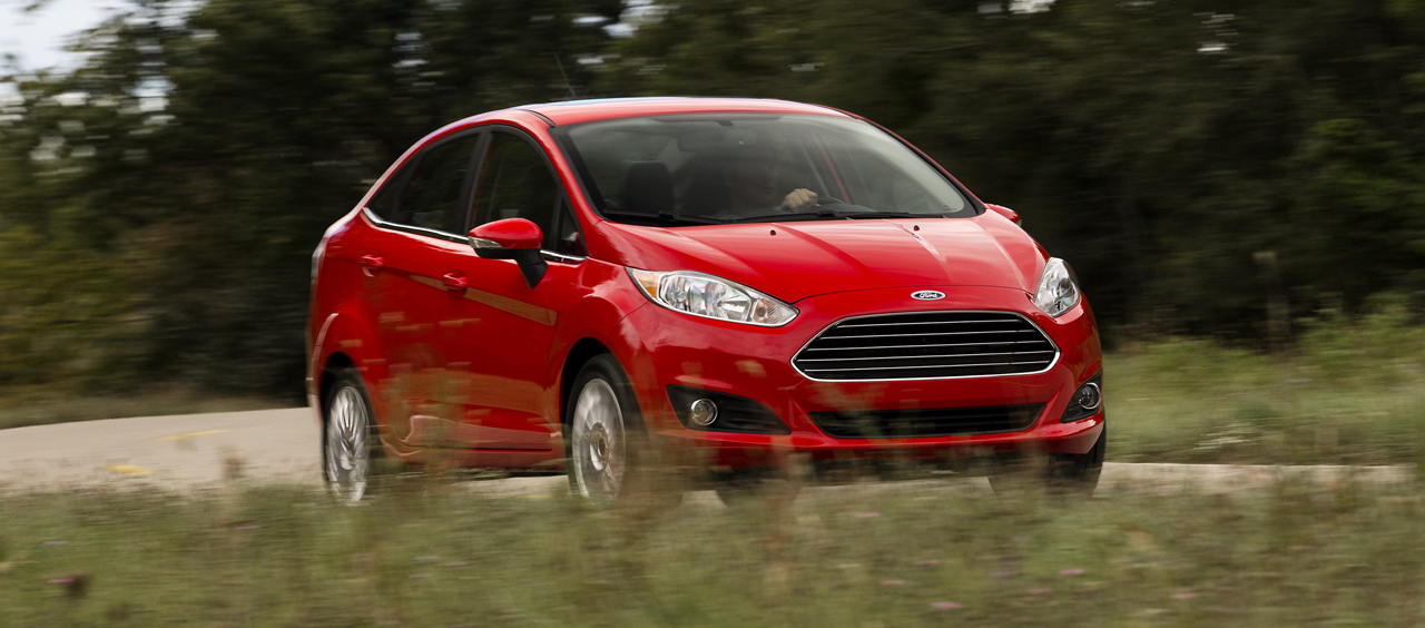 2013 Ford Fiesta sedan (global) front 3/4 driving