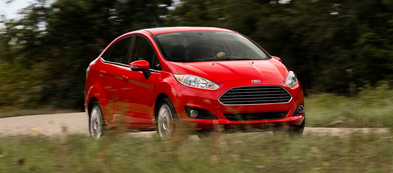 2013 Ford Fiesta sedan (global) front 3/4 driving