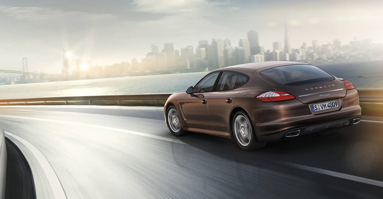 2013 Porsche Panamera Platinum Edition rear 3/4 driving