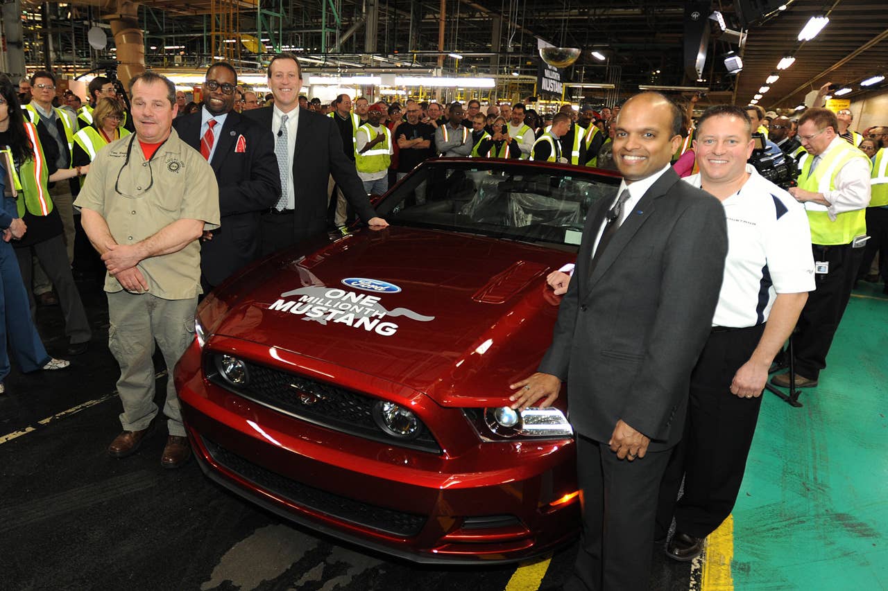Flat Rock, Mi. Tim Young, Flat Rock Assembly Plant, plant manager, Raj Nair, group vice president for product development, Dave Pericak, chief Mustang engineer, Tony Bondy, UAW Local 3000 chairman, Jimmy Settles, UAW vice president, pose in front of the 1 millionth commemorative Mustang at the Flat Rock Assembly Plant. (04/17/2013)