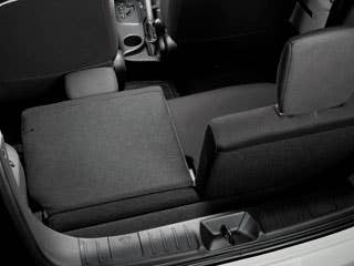 The iQ will be the smallest 4-seater sold in America, but the company is playing fast and loose with the number 4. Here's how they come to their conclusion: The front seats are slightly offset, leaving room for one adult in the back as well as space for a child, pet, small package or scale model of an actual 4-seater. The front seats are incredibly thin, too, so those rear passengers can maximize their legroom. The rear seats split in half and fold flat as well. Even though we can't imagine the owner who would do this, Toyota says the rear cargo area achieves the all-American checkmark of accommodating a golf bag with the seats folded flat. More related to Scion iQ:Research All Scion VehiclesCheap Hybrid CarsResearch All Hatchbacks