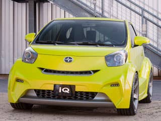Where the Smart ForTwo went for cute and child-like in its design direction, the Scion iQ takes another tact altogether. The high beltline wraps around the car and into a very aggressive, angry-looking set of front headlights. The front fascia is cut with all manner of (mostly non-functional) intake openings, giving the appearance of a fire-breathing car that needs all the air it can get. Out back, the smoked rear lenses seem to melt into the sickle-shaped rear quarter glass. Wheels are pushed to the corners, like the Smart (where else are they going to go on a car this small?), but the openings are blistered and sculpted to look wide and muscular. It is a car with a Napoleon complex.More related to Scion iQ:Research All Scion VehiclesCheap Hybrid CarsResearch All Hatchbacks