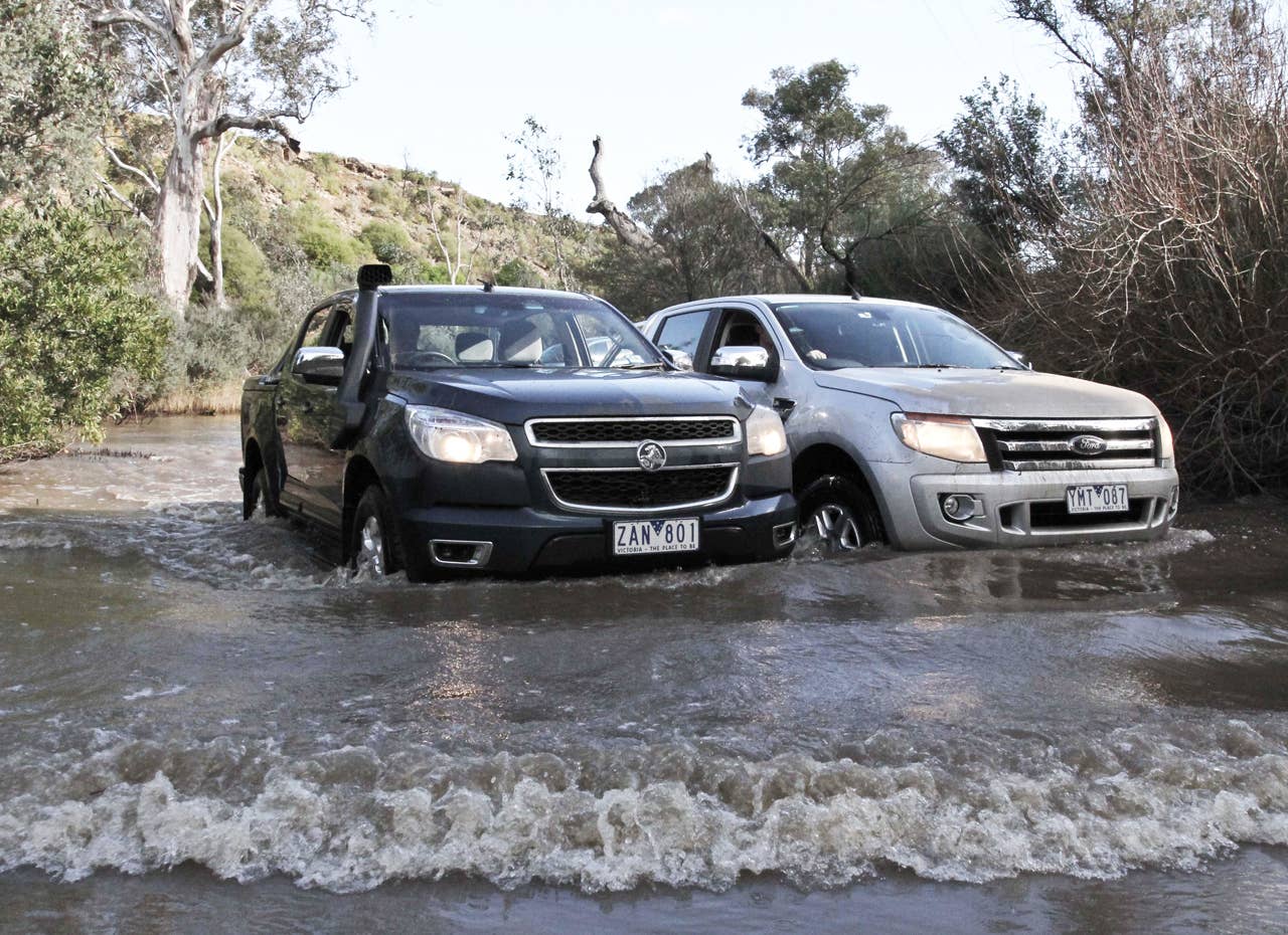 Holden Colorado and Ford Ranger at a stream crossing