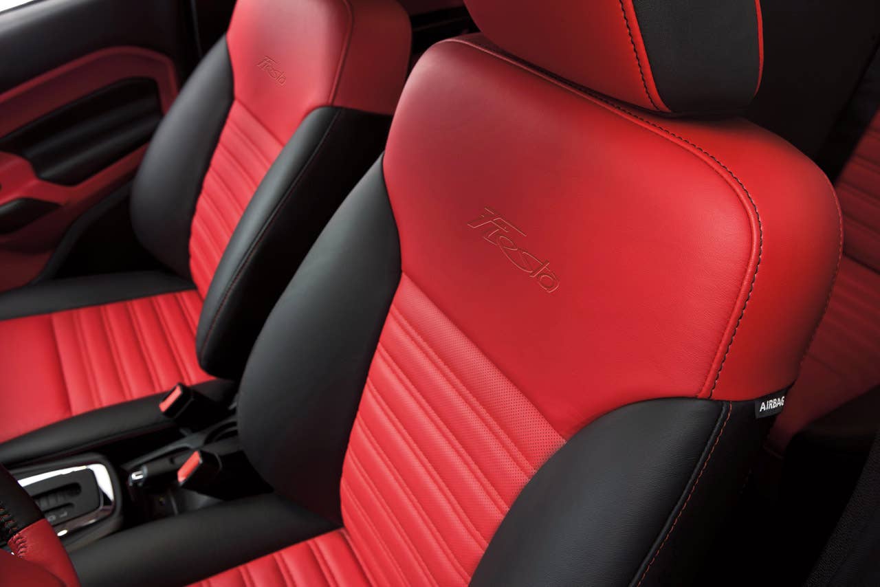 Ford Fiesta launches three new personalization packages for 2012, including two interior packages and one exterior package offering customers the ultimate in customization.  Shown here is the new interior package which delivers a custom look with two-tone seating surfaces, door trim inserts, steering wheel and interior components, available in both Race Red and Oxford White. (03/23/2011)