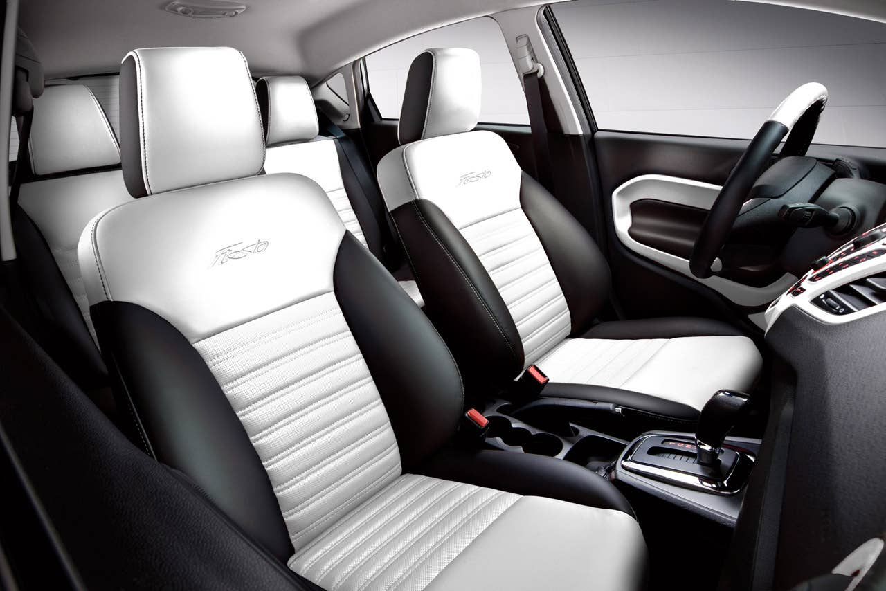 Ford Fiesta launches three new personalization packages for 2012, including two interior packages and one exterior package offering customers the ultimate in customization.  Shown here is the new interior package which delivers a custom look with two-tone seating surfaces, door trim inserts, steering wheel and interior components, available in both Race Red and Oxford White. (03/23/2011)
