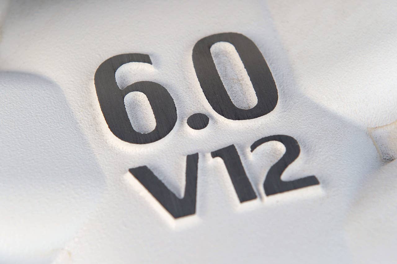 2011 Aston Martin V12 Vantage engine badge