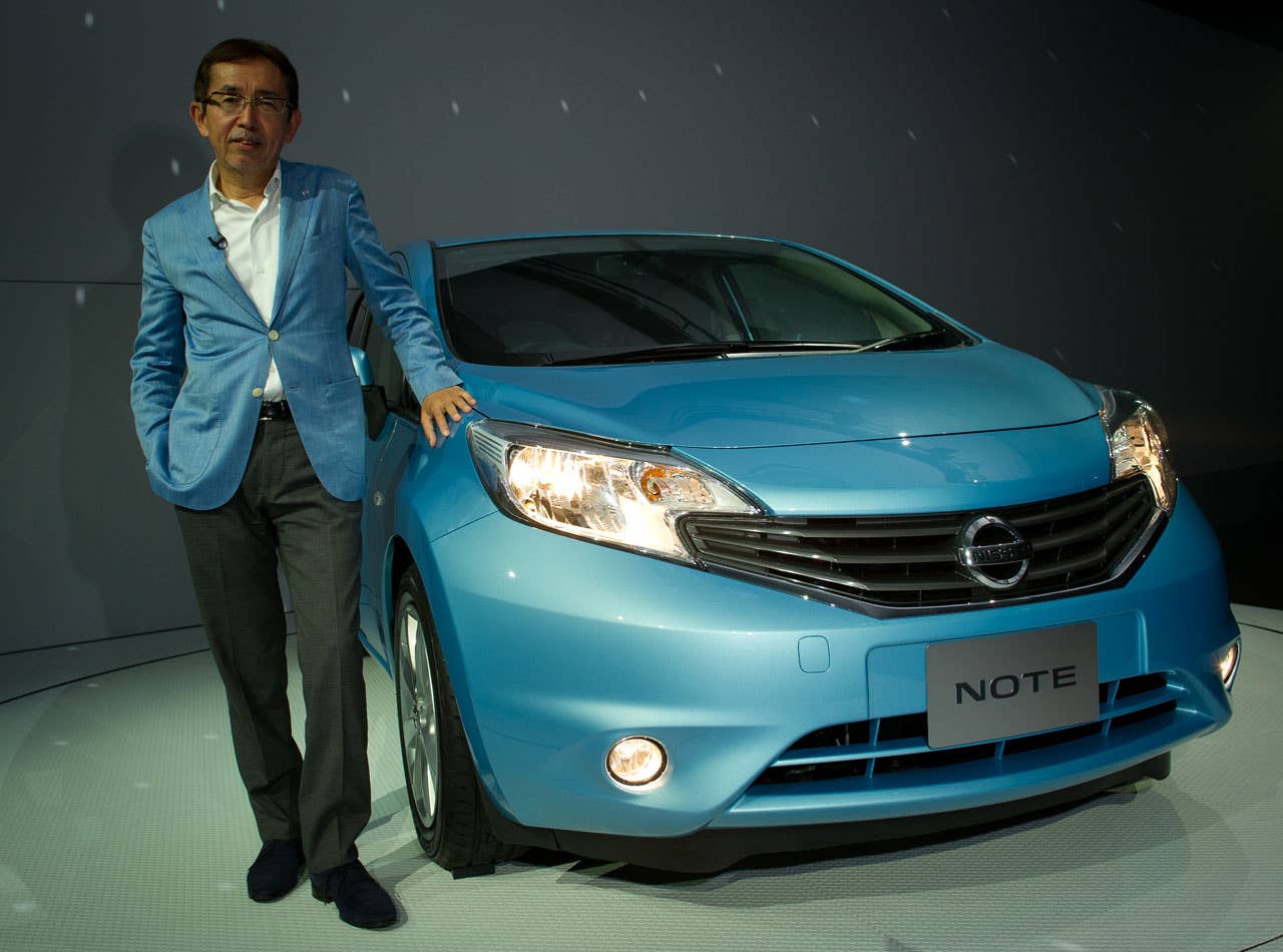 CCO Shiro Nakamura stands next to the New Nissan Note unveiled in Yokohama.