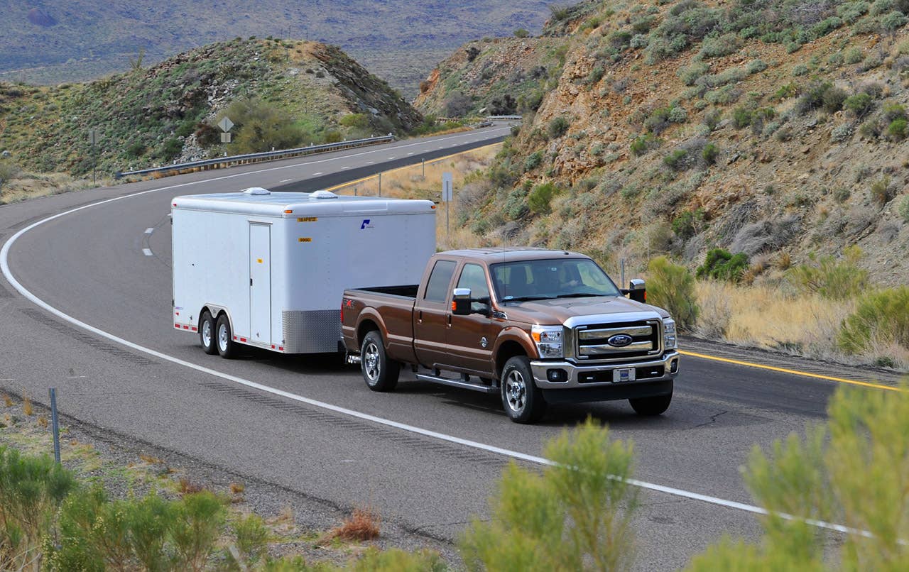 PHOENIX, AZ., March 2, 2010-- A 2011 Ford Super Duty pickup pulls a 10,000-pound trailer up a grade near Yarnell, Ariz. The 2011 Ford Super Duty has best-in-class maximum conventional trailer tow capability of 16,000 pounds with the F-450 pickup. The area is used by Ford engineers to prove out the capabilities of the 2011 F-Series Super Duty. Photo by: Sam VarnHagen/Ford Motor Co.the F-450 pickup. The area is used by Ford engineers to prove out the capabilities of the 2011 F-Series Super Duty.  Photo by: Sam VarnHagen/Ford Motor Co. (3/8/2010)