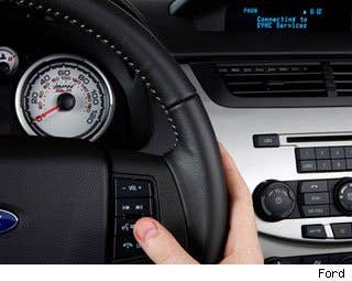 What It Is: A program in the car that uses the person’s voice commands to operate different features in the car ranging from finding a song on an iPod to adjust the air conditioner.  Why It's Important: Keeping your hands on the wheel is a key to good driving. Operating switches and knobs and buttons by voice allows any driver to keep both hands on the wheel even more often. Furthermore, if a car has voice recognition software, it will also have the means to speak on your phone hands free. Ten states require all drivers to use a hands free device when operating a cell phone and more states are expected to pass similar laws.  However, it’s essential to learn how to use your voice recognition software correctly. Some systems require specific commands in order to properly connect with the car’s computer. These systems can become frustrating if you don’t take the time to learn how it works.