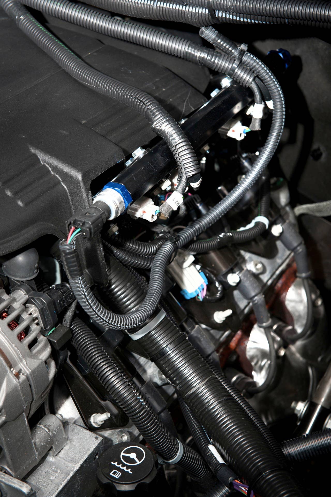 The 2013 bi-fuel Chevrolet Silverado HD features a compressed natural gas (CNG) capable Vortec 6.0L V8 engine. The bi-fuel Silverado HD will be covered by General Motors' three-year, 36,000-mile new vehicle limited warranty and five-year, 100,000-mile limited powertrain warranty. (Photo by James Fassinger for Chevrolet)