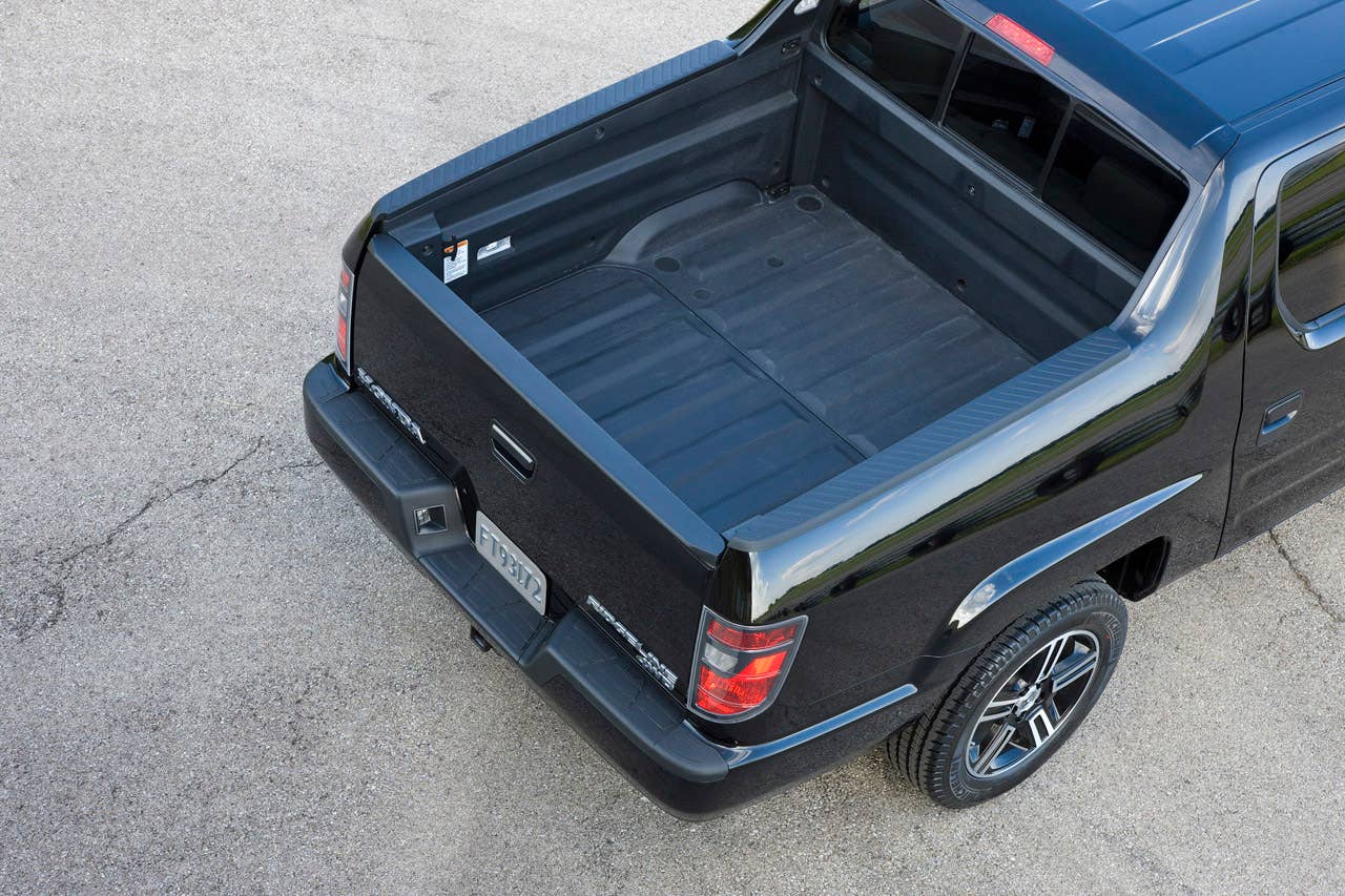 2012 Honda Ridgeline Sport pickup bed with in-bed trunk.