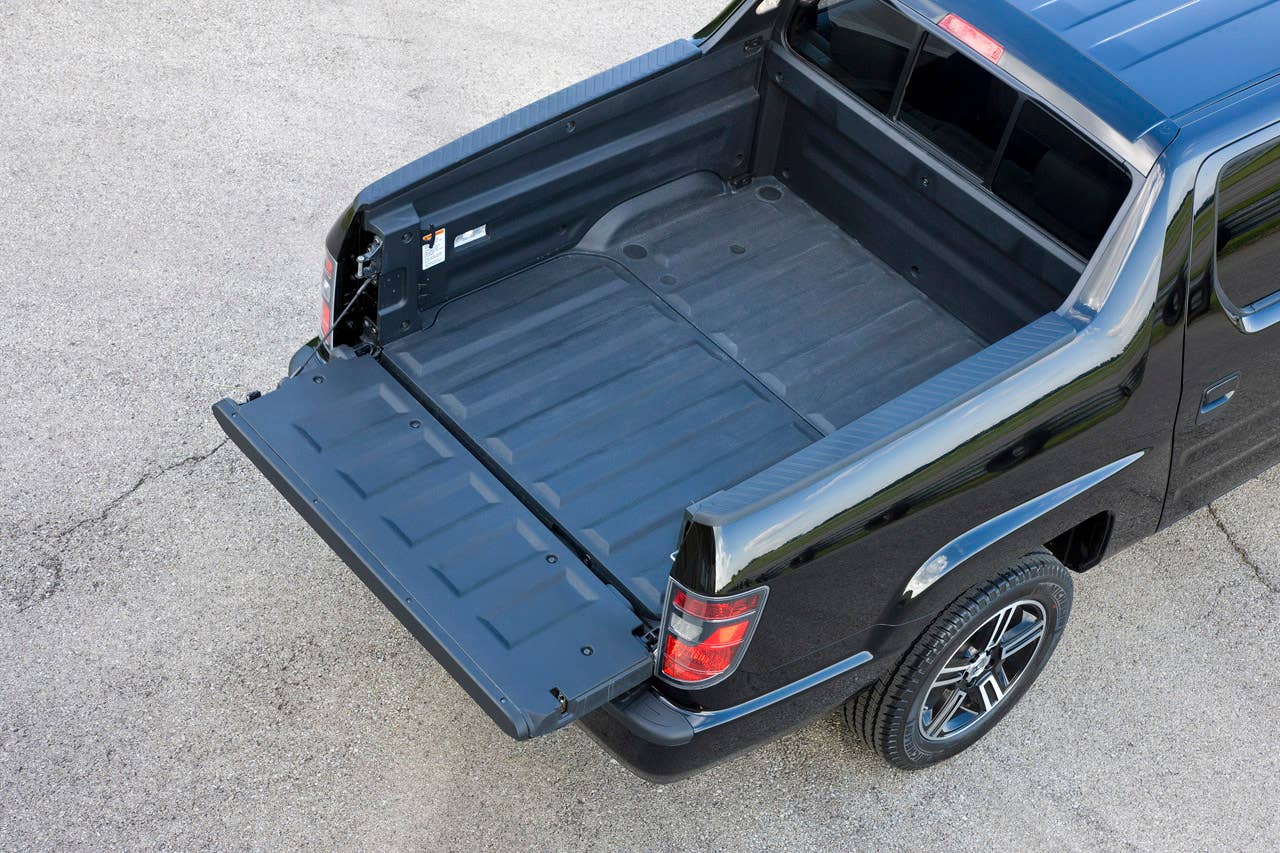 2012 Honda Ridgeline Sport pickup bed with in-bed trunk.