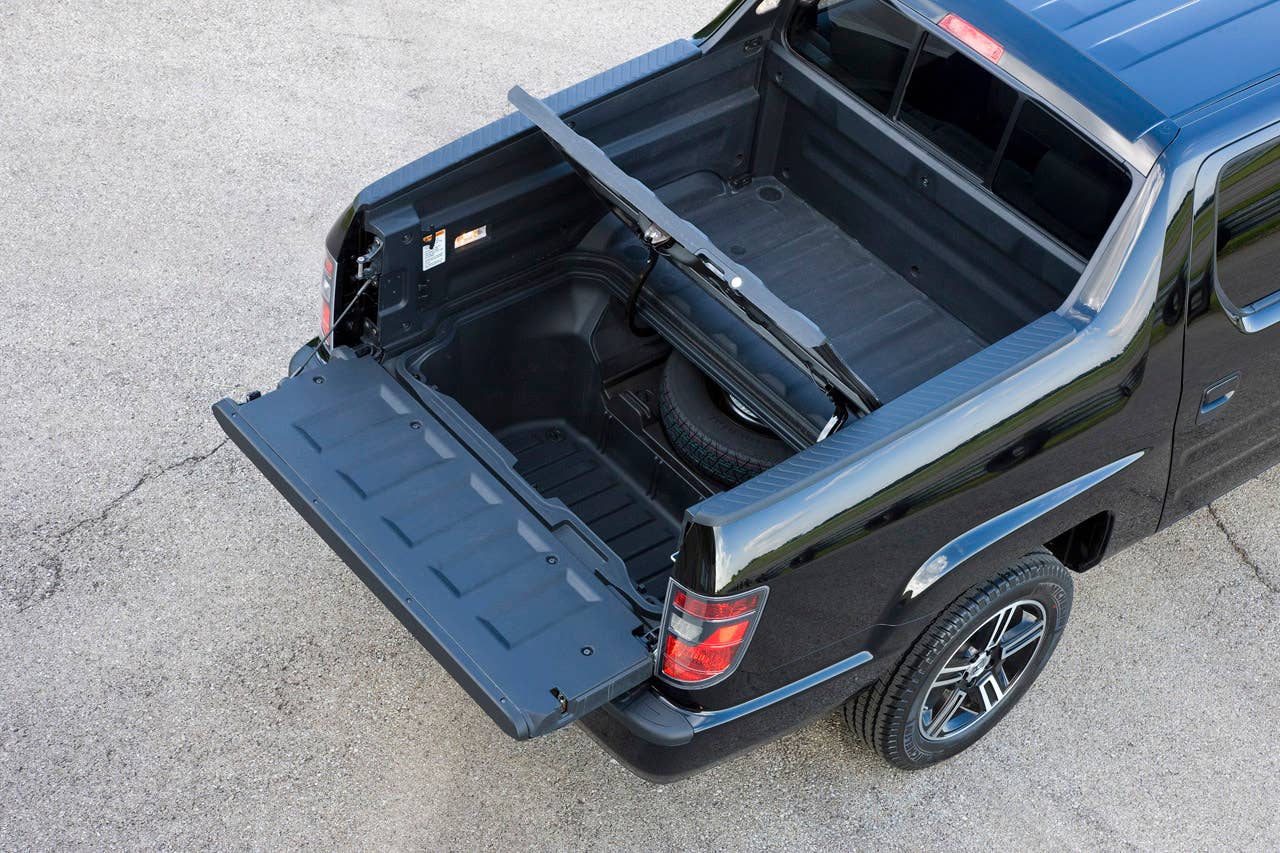 2012 Honda Ridgeline Sport pickup bed with in-bed trunk.