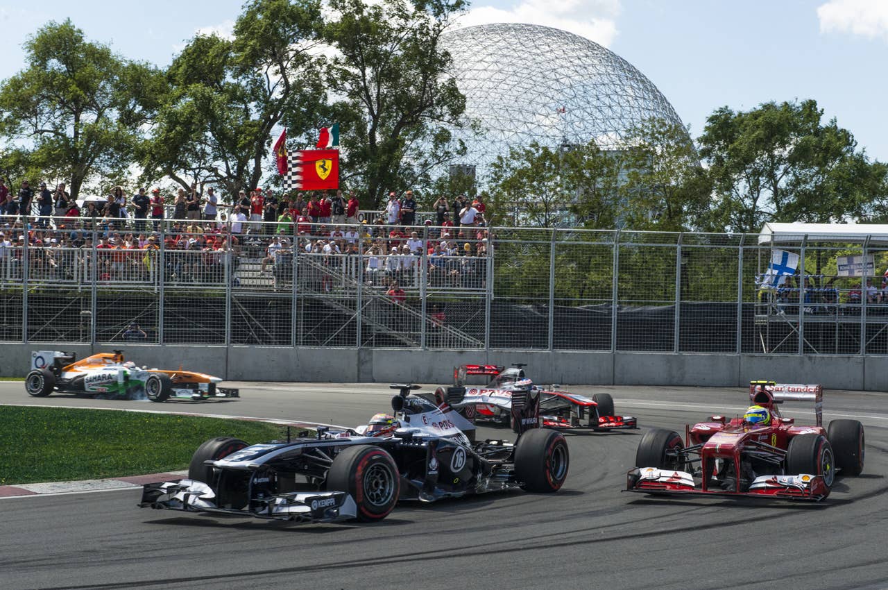Cars pass the hairpin corner during the frist laps of the Canadian Formula One Grand Prix at the Circuit Gilles Villeneuve in Montreal on June 9, 2013.    AFP PHOTO / ROGERIO BARBOSAROGERIO BARBOSA/AFP/Getty Images