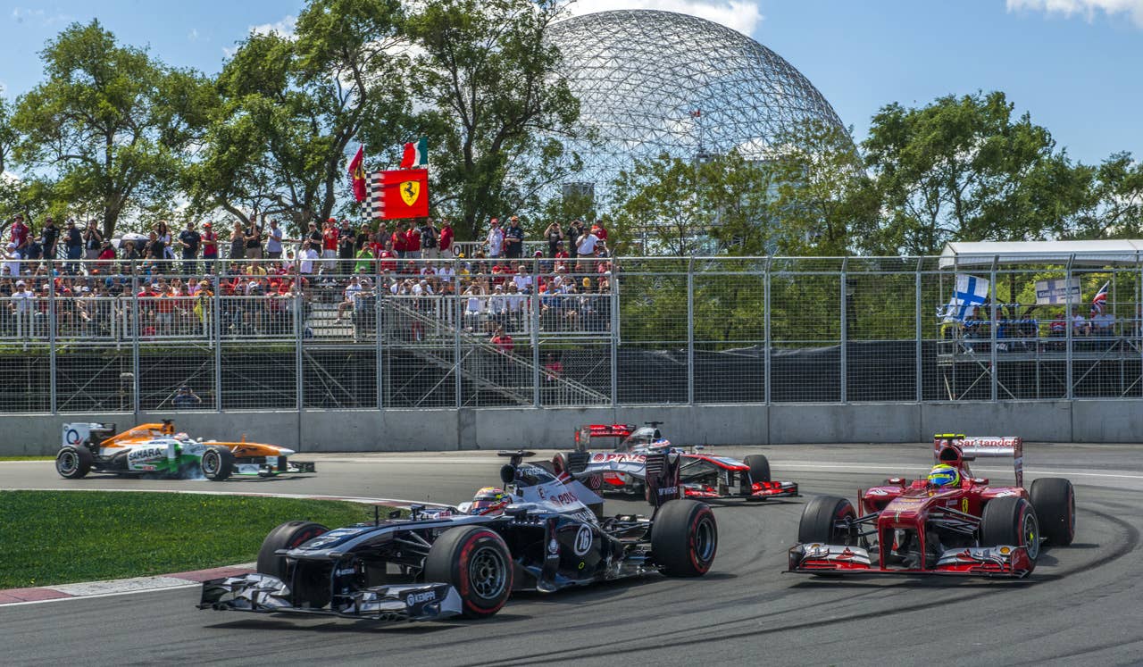 Williams F1 Team Pablo Maldonado in front of other F1 teams as he passes in the hairpin corner, during the F1 Grand Prix race at the Circuit Gilles Villeneuve in Montreal on June 9, 2013 during the Canadian Formula One Grand Prix.    AFP PHOTO / ROGERIO BARBOSAROGERIO BARBOSA/AFP/Getty Images