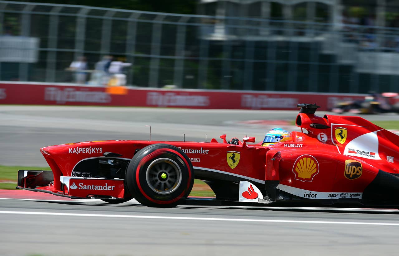 Ferrari driver Fernando Alonso of Spain in the opening laps of the Canadian Formula One Grand Prix at the Circuit Gilles Villeneuve in Montreal on June 9, 2013.    AFP PHOTO/Emmanuel DUNANDEMMANUEL DUNAND/AFP/Getty Images