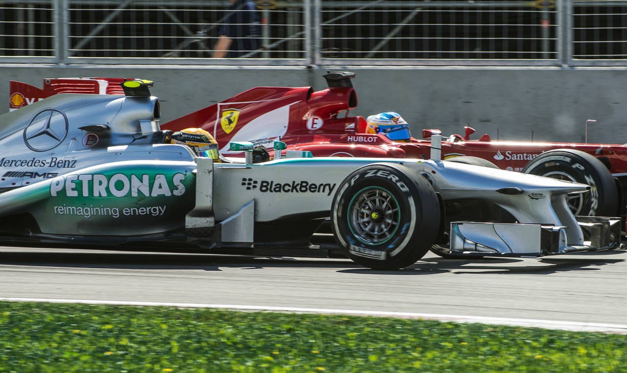 Mercedes driver Lewis Hamilton of Britain Ferrari's Fernando Alonso of Spain fight it out in the hairpin corner at the Circuit Gilles Villeneuve in Montreal on June 9, 2013 during the Canadian Formula One Grand Prix.    AFP PHOTO / ROGERIO BARBOSAROGERIO BARBOSA/AFP/Getty Images