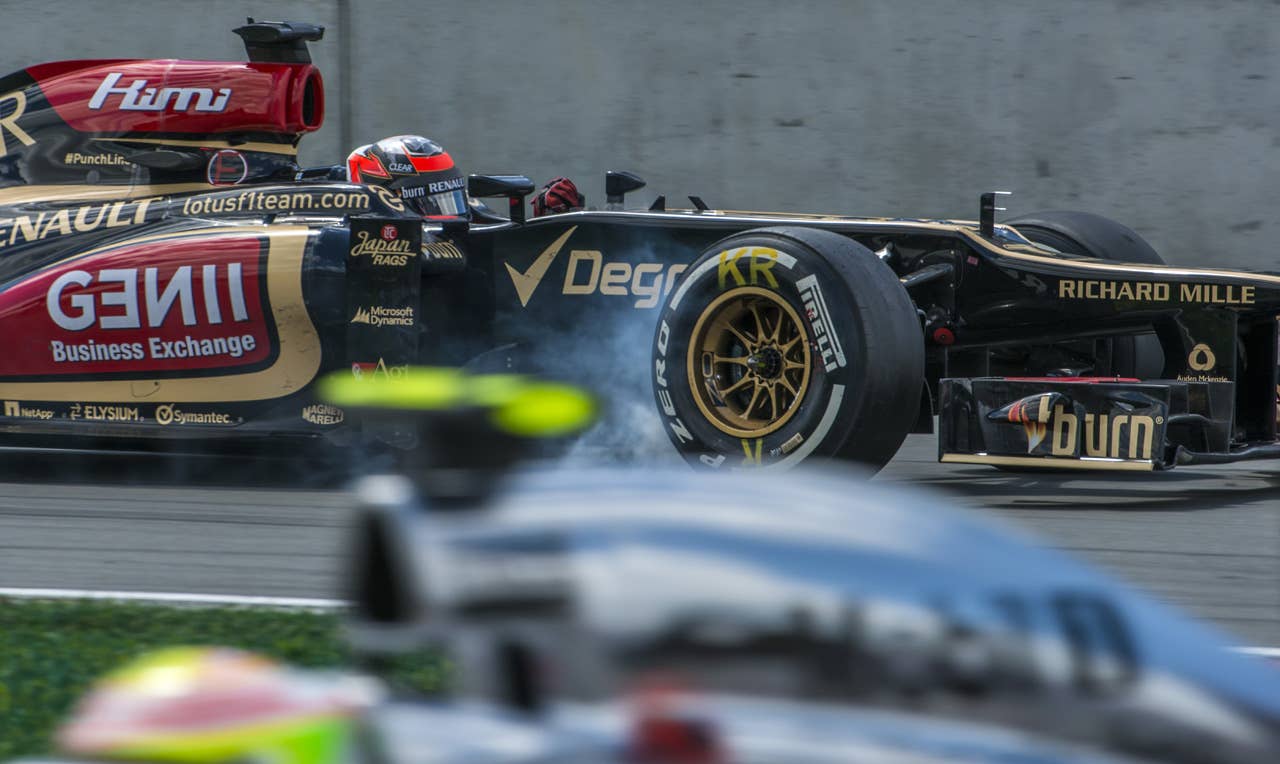 Lotus driver Kimi Raikkonen from Finland presses hard on the brakes in the hairpin corner at the Circuit Gilles Villeneuve in Montreal on June 9, 2013 during the Canadian Formula One Grand Prix.    AFP PHOTO / ROGERIO BARBOSAROGERIO BARBOSA/AFP/Getty Images