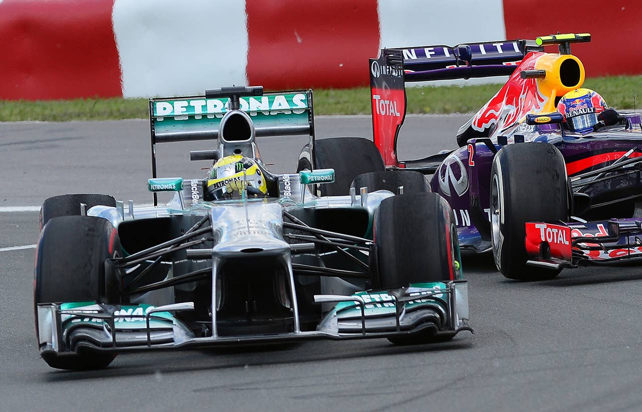 Mercedes driver Nico Rosberg powers his car to fifth place as he battles for position with fourth place Red Bull driver Mark Webber of Australia in the Canadian Formula One Grand Prix at the Circuit Gilles Villeneuve in Montreal, June 9, 2013. AFP PHOTO/Emmanuel DunandEMMANUEL DUNAND/AFP/Getty Images