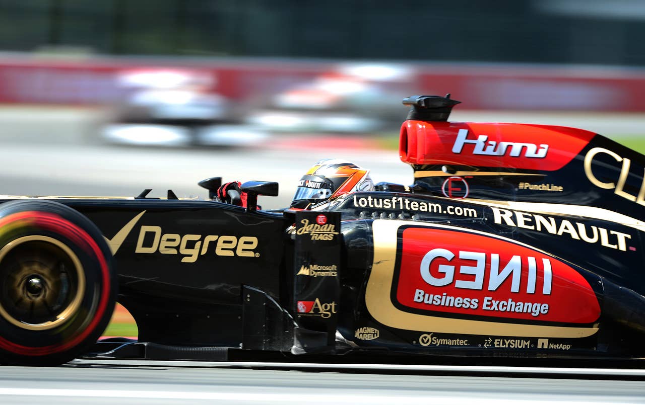 Lotus driver Kimi Raikkonen of finland powers his car to ninth place in the Canadian Formula One Grand Prix at the Circuit Gilles Villeneuve in Montreal, June 9, 2013.   AFP PHOTO/Emmanuel DunandEMMANUEL DUNAND/AFP/Getty Images