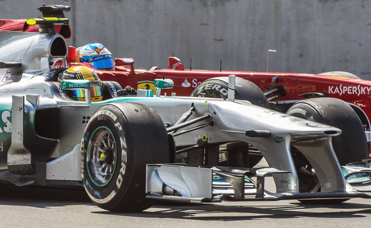 Mercedes driver Lewis Hamilton of Britain Ferrari's Fernando Alonso of Spain fight it out in the hairpin corner at the Circuit Gilles Villeneuve in Montreal on June 9, 2013 during the Canadian Formula One Grand Prix.    AFP PHOTO / ROGERIO BARBOSAROGERIO BARBOSA/AFP/Getty Images
