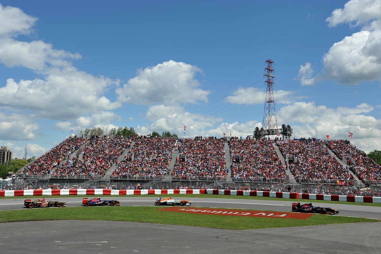 Cars enter turn two in the opening laps of the Canadian Formula One Grand Prix at the Circuit Gilles Villeneuve in Montreal on June 9, 2013.     AFP PHOTO/Stan HONDASTAN HONDA/AFP/Getty Images