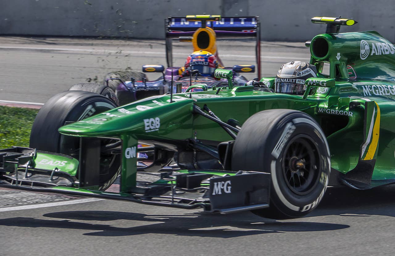 Catherham F1 Team Giedo Van Der Garde of the Netherlands being hit by Red Bull Mark Webber from Australia at the hairpin corner at the Circuit Gilles Villeneuve in Montreal on June 9, 2013 during the Canadian Formula One Grand Prix.    AFP PHOTO / ROGERIO BARBOSAROGERIO BARBOSA/AFP/Getty Images