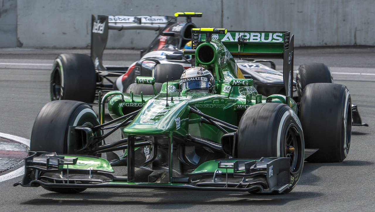 Catherham driver Giedo Van Der Garde of the Netherlands in front of Sauber's Esteban Guttierrez of Mexico at the hairpin corner at the Circuit Gilles Villeneuve in Montreal on June 9, 2013 during the Canadian Formula One Grand Prix.    AFP PHOTO / ROGERIO BARBOSAROGERIO BARBOSA/AFP/Getty Images