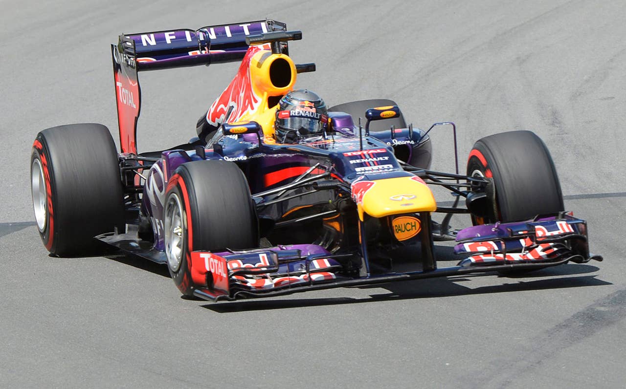 Red Bull driver Sebastian Vettel, of Germany, leads the pack at the start of the Canadian Grand Prix auto race in Montreal, Sunday, June 9, 2013. (AP Photo/The Canadian Press, Ryan Remiorz)