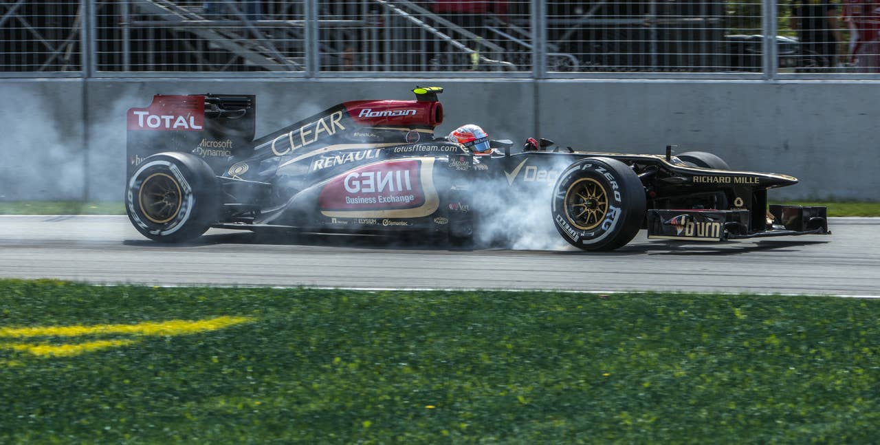 Lotus driver Romain Grosjean of France presses hard on the brakes in the hairpin corner at the Circuit Gilles Villeneuve in Montreal on June 9, 2013 during the Canadian Formula One Grand Prix.    AFP PHOTO / ROGERIO BARBOSAROGERIO BARBOSA/AFP/Getty Images