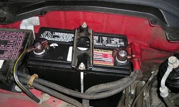 If a thief can get under your hood, there isn't a lot they can make off with that's valuable. The engine is a little heavy and pretty well contained, the dipstick isn't going to bring a lot of coin, but the battery is easily removable and contains lead, which is valuable to scrappers. A thief can steal a battery quickly and with minimal risk. A recycled battery can net $20 at a scrap yard and thieves usually hit multiple cars in an area to rack in the largest rewards. To replace a battery costs usually between $80 to $200, depending on the make and model.  How To Protect Your Vehicle  Bolting them into your car isn't an option. You can buy and install after marker hood locks for your vehicle, as well as park in well lit parking lots where digging around under a hood would be suspicious.