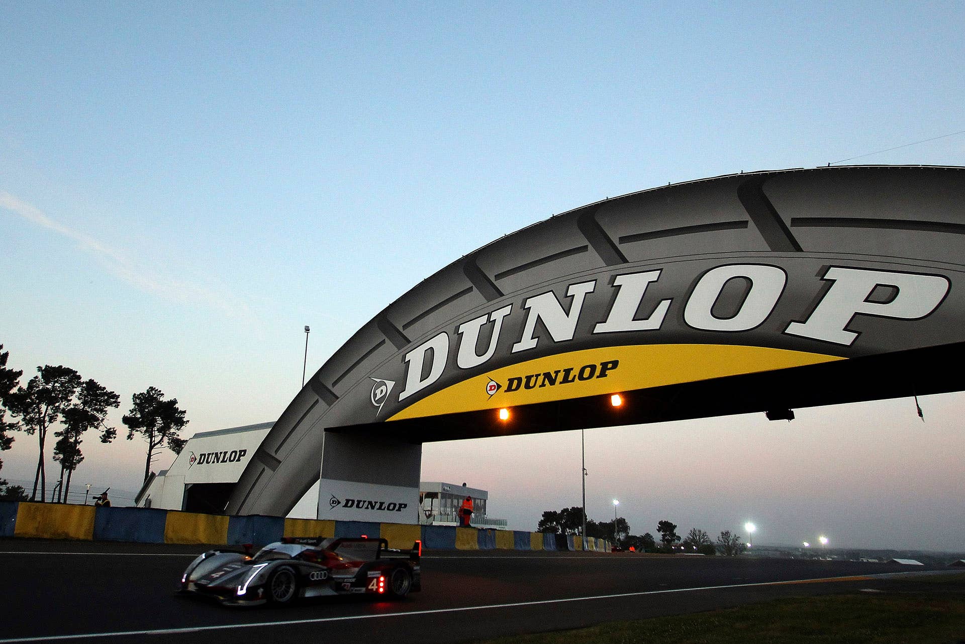 The Audi R18 Ultra No. 4 driven by Mike Rockenfeller of Germany is seen in action at daybreak during the 80th 24-hour Le Mans endurance race, in Le Mans, western France, Sunday, June 17, 2012. (AP Photo/David Vincent)