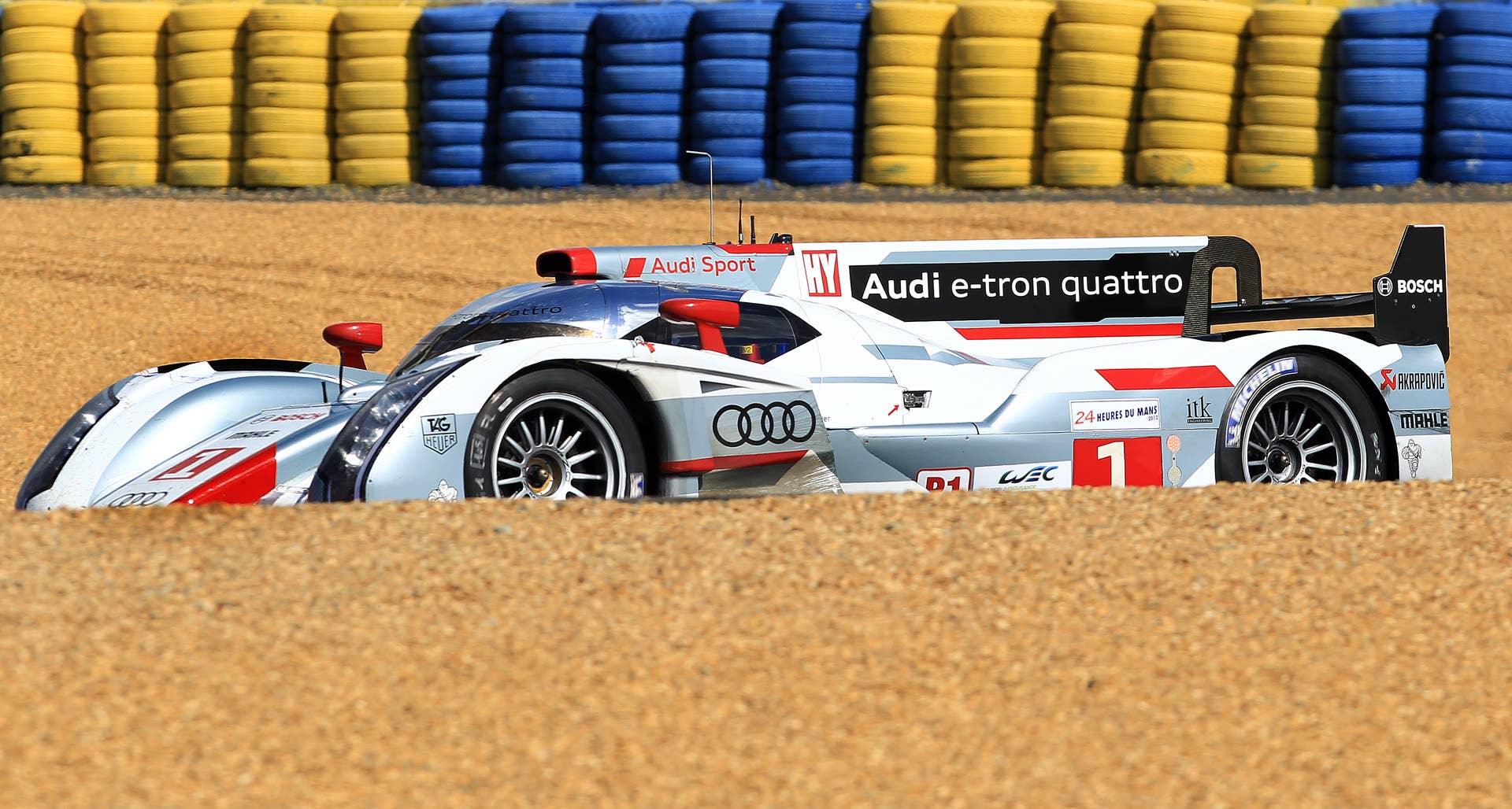 The Audi R18 TDI No1 driven by Andre Lotterer of Germany takes a curve during the 80th 24-hour Le Mans endurance race, in Le Mans, western France, Saturday, June 16, 2012. (AP Photo/Bob Edme)