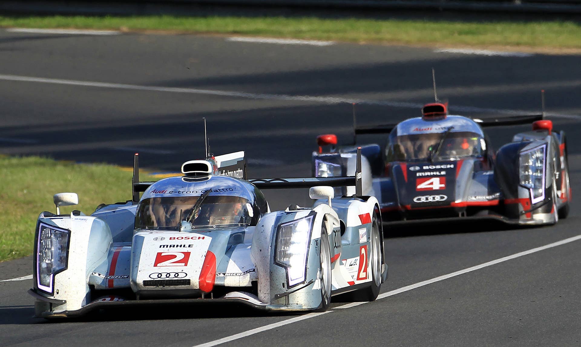 The Audi R18 TDI No2 driven by Allan MacNish of Scotland, Rinaldo Capello of Italy and Tom Kristensen of Dennark ahead of the Audi R18 ultra during the 80th 24-hour Le Mans endurance race, in Le Mans, western France, Saturday, June 16, 2012. (AP Photo/Bob Edme)