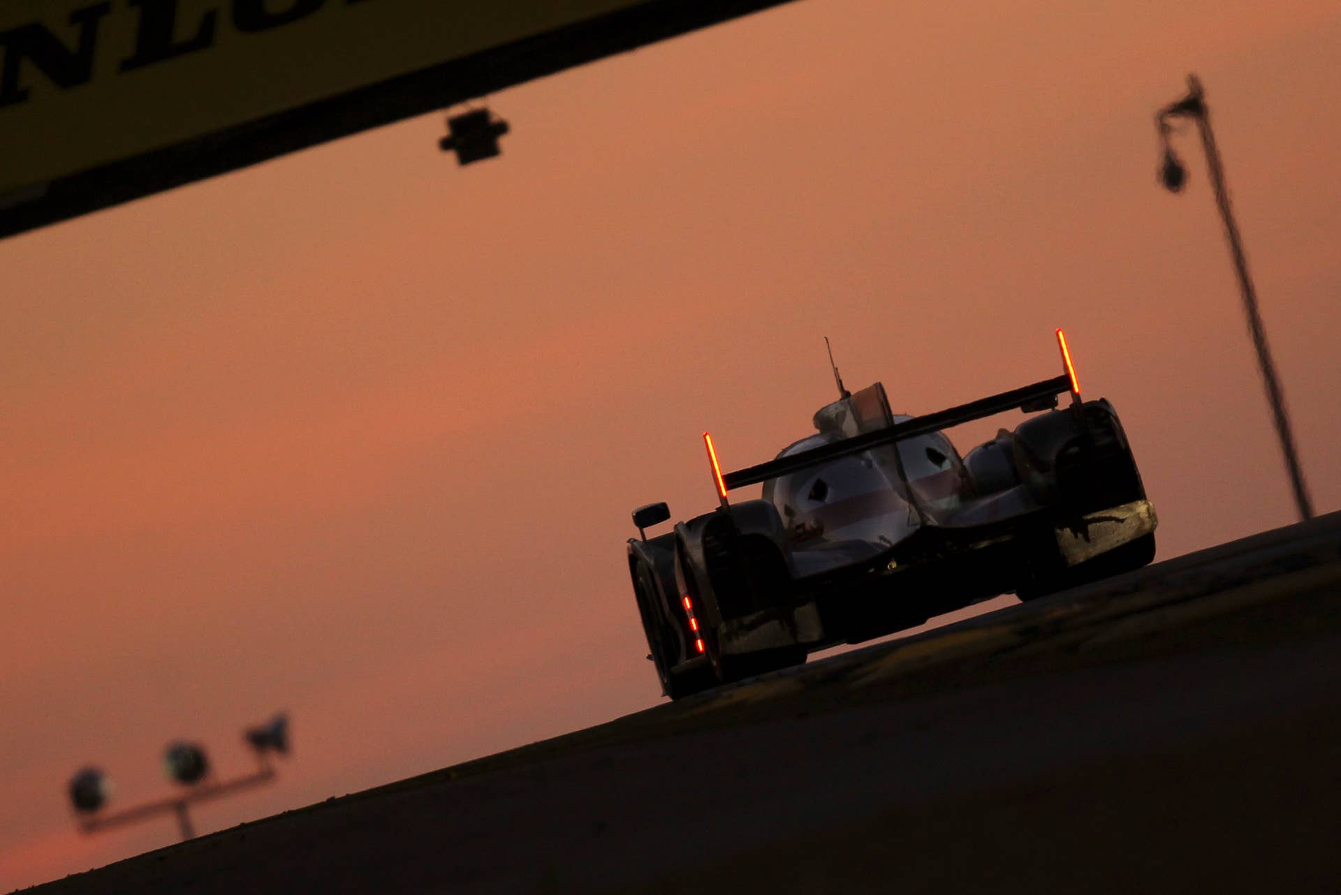 The Audi R18 Ultra No. 3 driven by Marc Gene of Spain, Romain Dumas and Loic Duval both of France is seen in action at daybreak during the 80th 24-hour Le Mans endurance race, in Le Mans, western France, Sunday, June 17, 2012. (AP Photo/David Vincent)