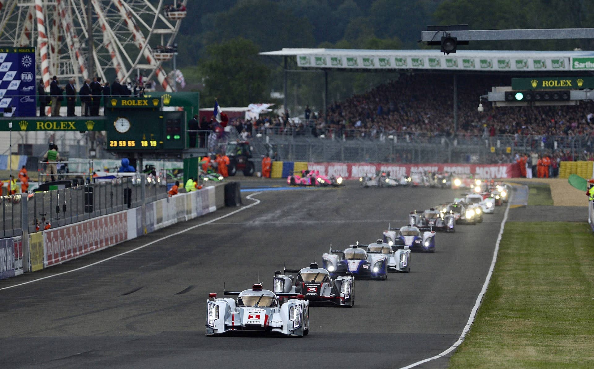 LE MANS, FRANCE - JUNE 16: Andre Lotterer of Germany and driver of the #1 Audi R18 e-tron quattro, takes the green flag and leads the field at the start of the 80th running of the Le Mans 24 Hour race at the Circuit des 24 Heures du Mans on June 16, 2012 in Le Mans, France (Photo by Rick Dole/Getty Images)