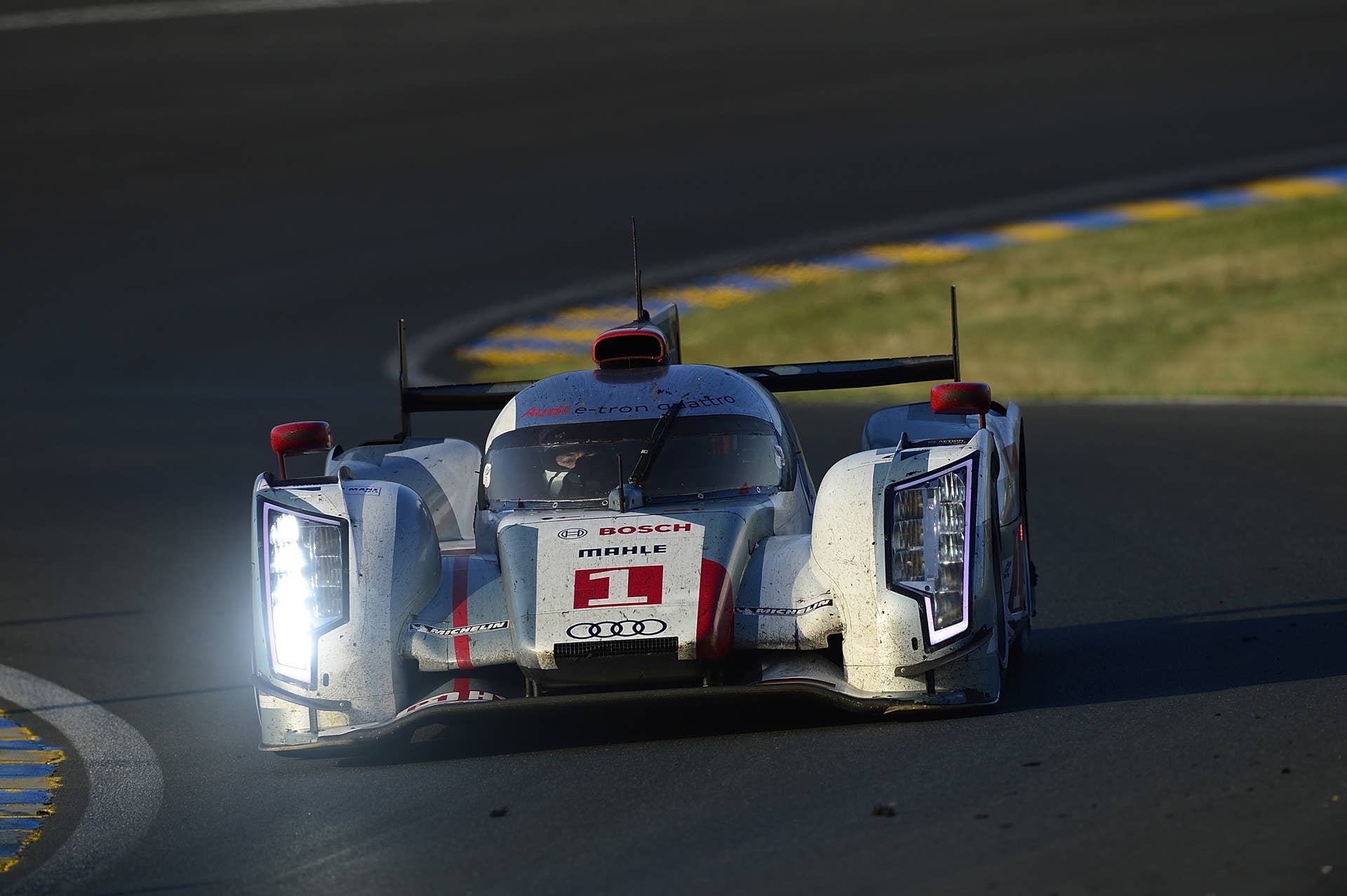 LE MANS, FRANCE - JUNE 17: The #1 Audi R18 e-tron quattro driven by Marcel Fassler of Switerland, Andre Lotterer of Germany, and Benoit Treluyer of France during the 80th running of the Le Mans 24 Hour race at the Circuit des 24 Heures du Mans on June 17, 2012 in Le Mans, France (Photo by Rick Dole/Getty Images)