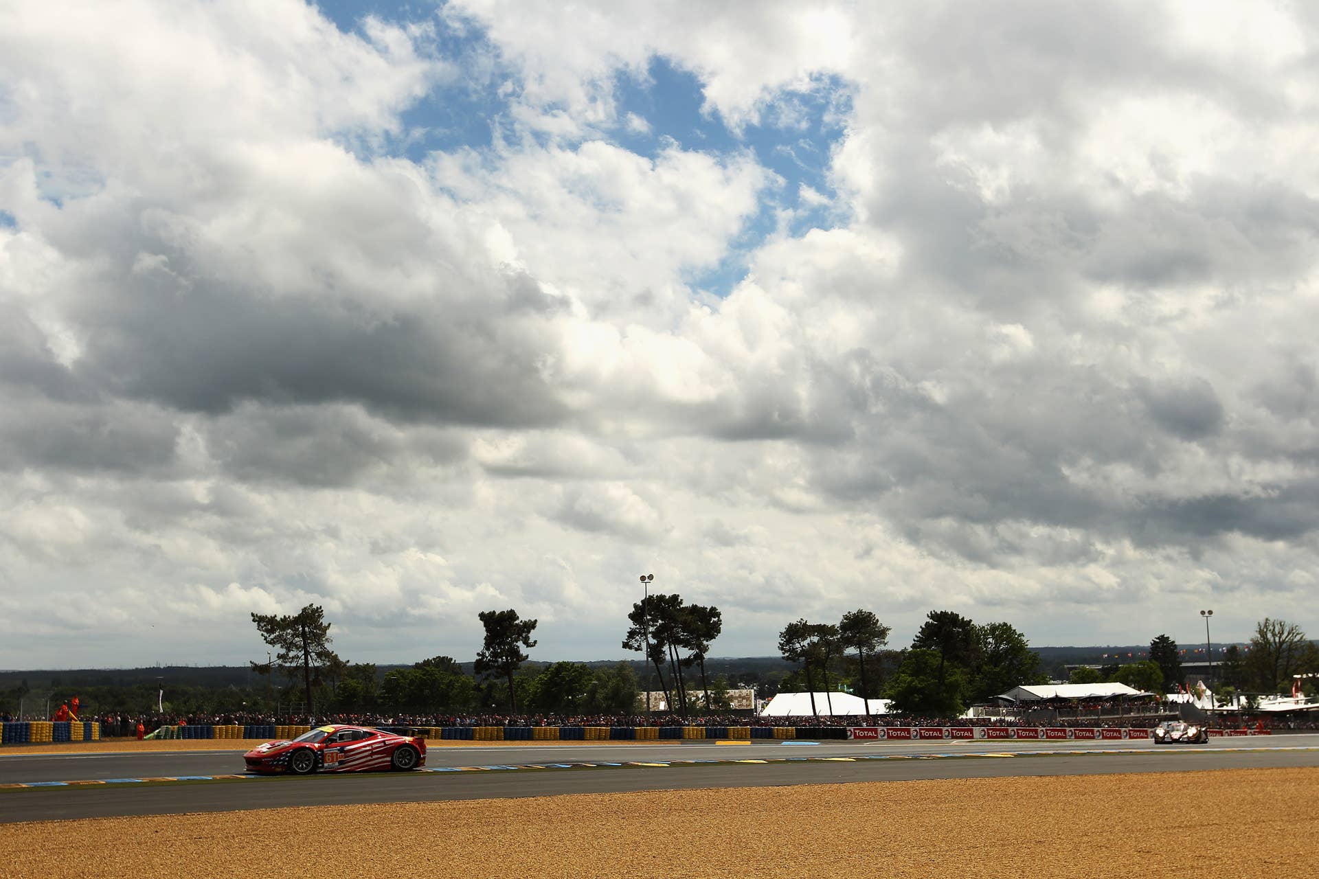 LE MANS, FRANCE - JUNE 16: The AF - Corse Michael Waltrip Racing Ferrari 458 of Robert Kauffman, Rui Aguas and Brian Vickers in action during Le Mans 24 Hour race at the Circuit de la Sarthe on June 16, 2012 in Le Mans, France. (Photo by Bryn Lennon/Getty Images)