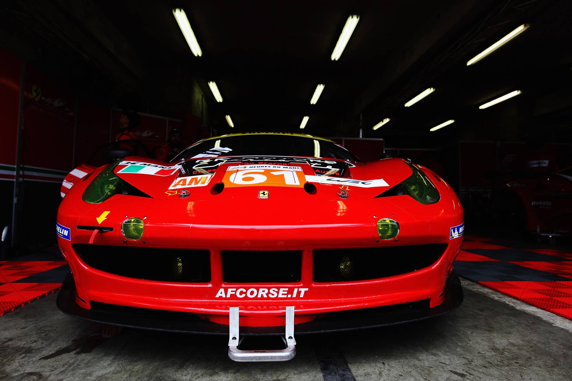 LE MANS, FRANCE - JUNE 16:  The AF - Corse Michael Waltrip Racing Ferrari 458 of Robert Kauffman, Rui Aguas and Brian Vickers sits in its team garage before the Le Mans 24 Hour race at the Circuit de la Sarthe on June 16, 2012 in Le Mans, France.  (Photo by Ker Robertson/Getty Images)