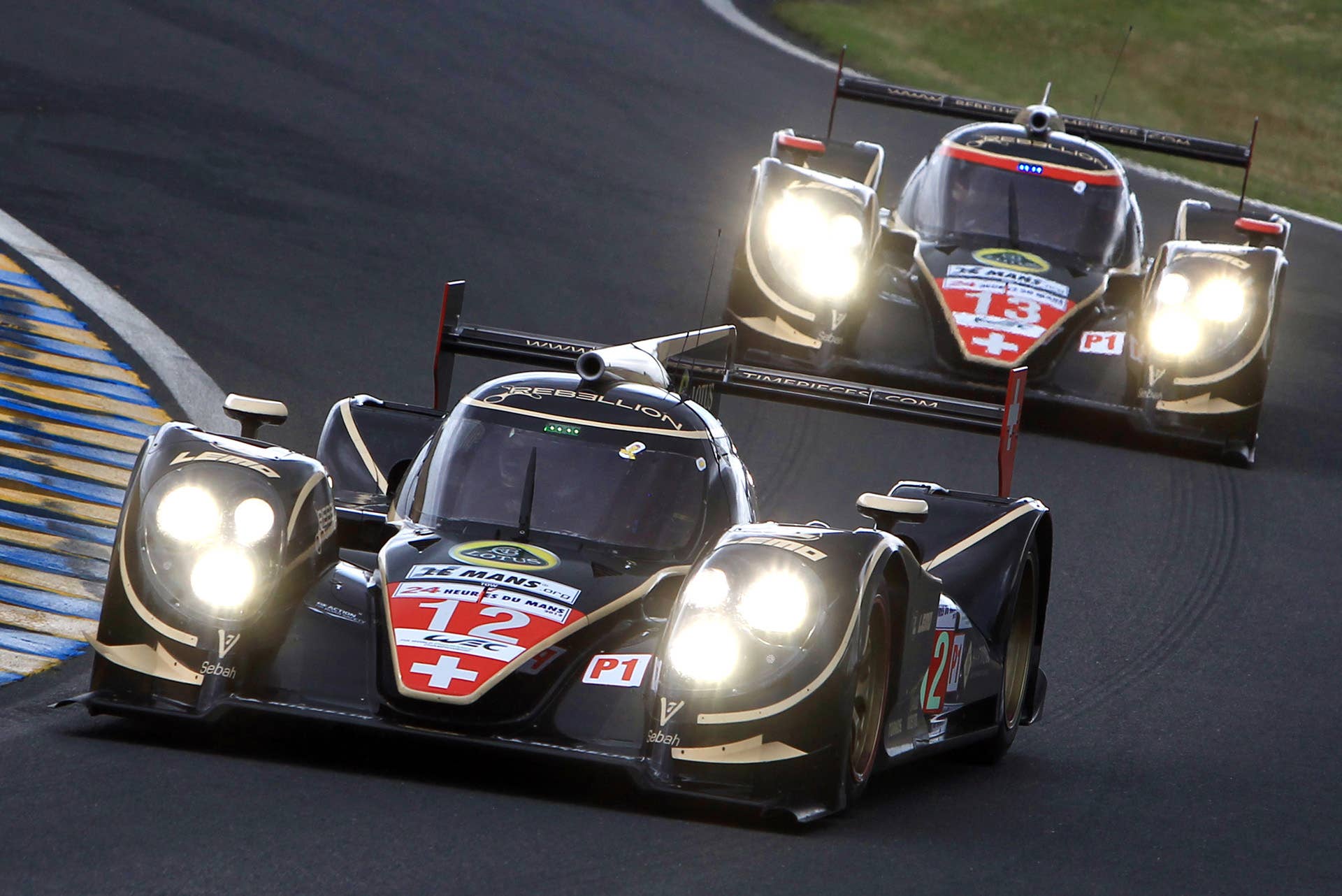 The Lola B12/60 driven by Nick Heidfeld of Germany in action ahead of the Lola 13 during the 80th 24-hour Le Mans endurance race, in Le Mans, western France, Saturday, June 16, 2012. (AP Photo/David Vincent)