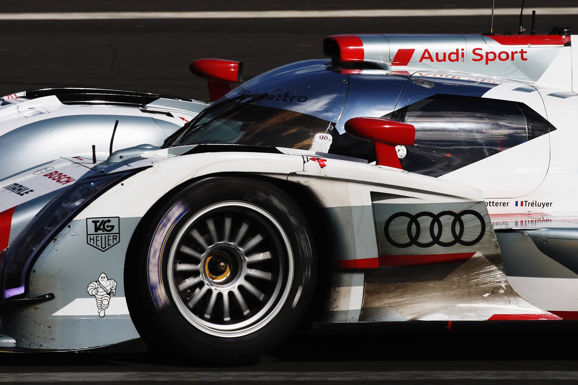 LE MANS, FRANCE - JUNE 16: The Audi Sport Team Joest R18 E-Tron Quattro of Andre Lotterer, Marcel Fassler and Benoit Treluyer drives during the Le Mans 24 Hour race at the Circuit de la Sarthe on June 16, 2012 in Le Mans, France. (Photo by Ker Robertson/Getty Images)