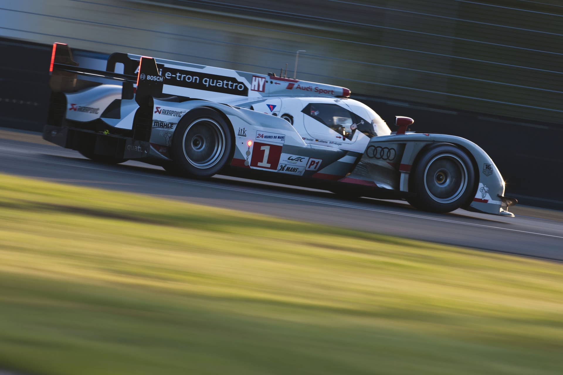 LE MANS, FRANCE - JUNE 16: The Audi Sport Team Joest Audi R18 e-tron quattro hybrid driven by Andre Lotterer of Germany, Benoit Treluyer of France and Marcel Fassler of Switzerland during the Le Mans 24 Hour race at the Circuit des 24 Heures du Mans on June 16, 2012 in Le Mans, France (Photo by Drew Gibson/Getty Images)