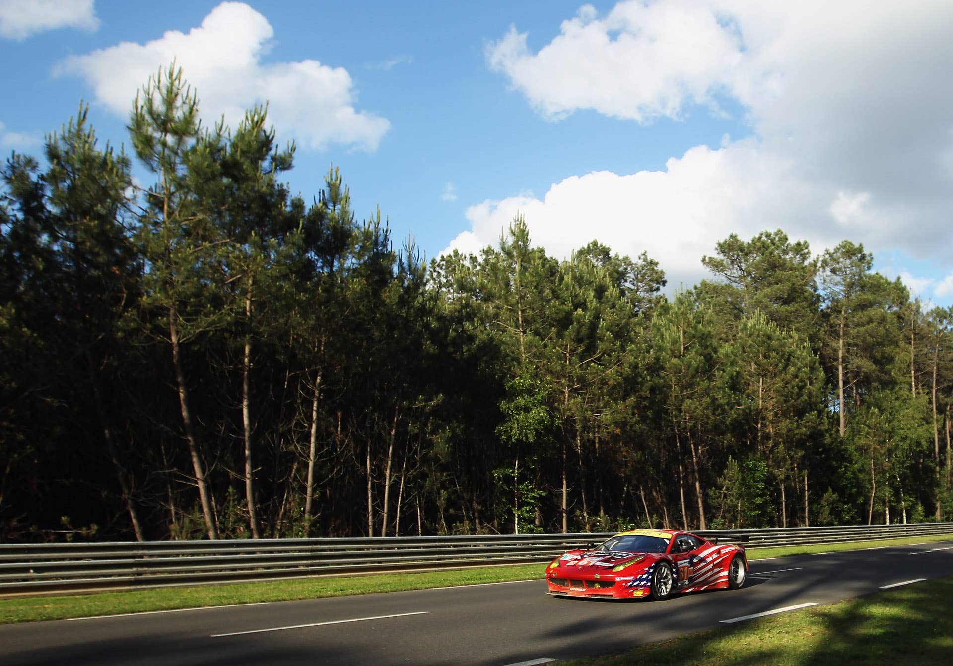 LE MANS, FRANCE - JUNE 16: The AF - Corse Michael Waltrip Racing Ferrari 458 of Robert Kauffman, Rui Aguas and Brian Vickers in action during Le Mans 24 Hour race at the Circuit de la Sarthe on June 16, 2012 in Le Mans, France. (Photo by Bryn Lennon/Getty Images)