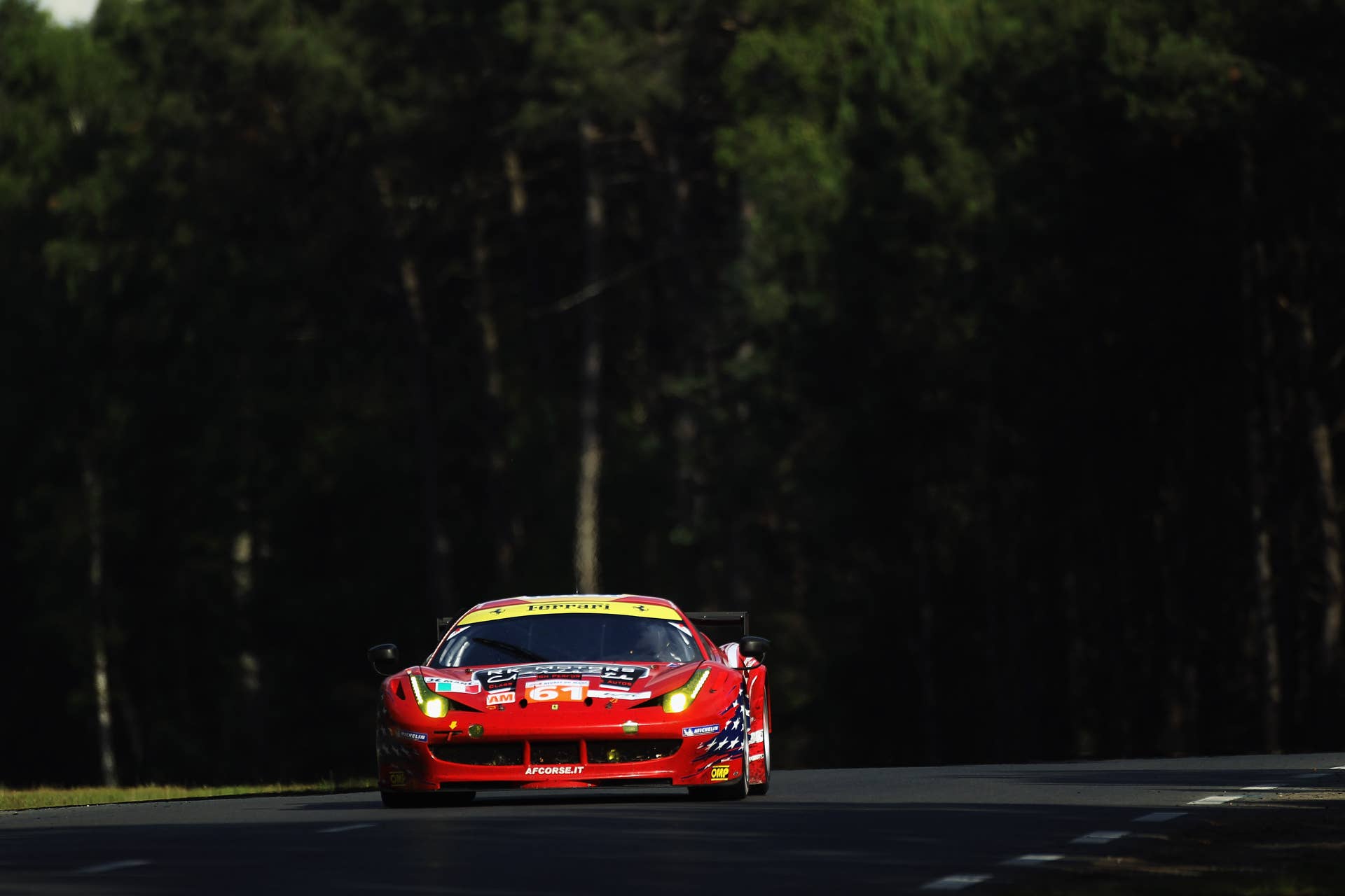 LE MANS, FRANCE - JUNE 16: The AF - Corse Michael Waltrip Racing Ferrari 458 of Robert Kauffman, Rui Aguas and Brian Vickers in action during Le Mans 24 Hour race at the Circuit de la Sarthe on June 16, 2012 in Le Mans, France. (Photo by Bryn Lennon/Getty Images)
