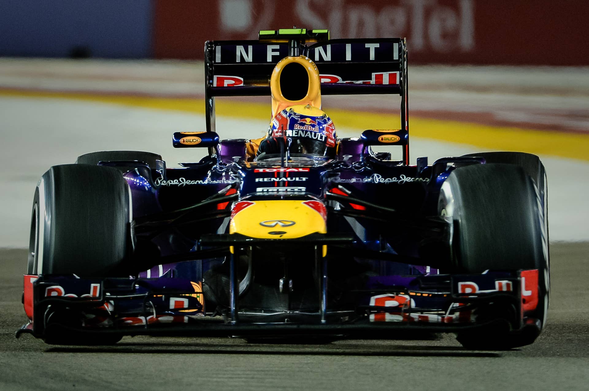 Red Bull driver Mark Webber of Australia drives during the Formula One Singapore Grand Prix on September 22, 2013.   AFP PHOTO / Philippe Lopez        (Photo credit should read PHILIPPE LOPEZ/AFP/Getty Images)