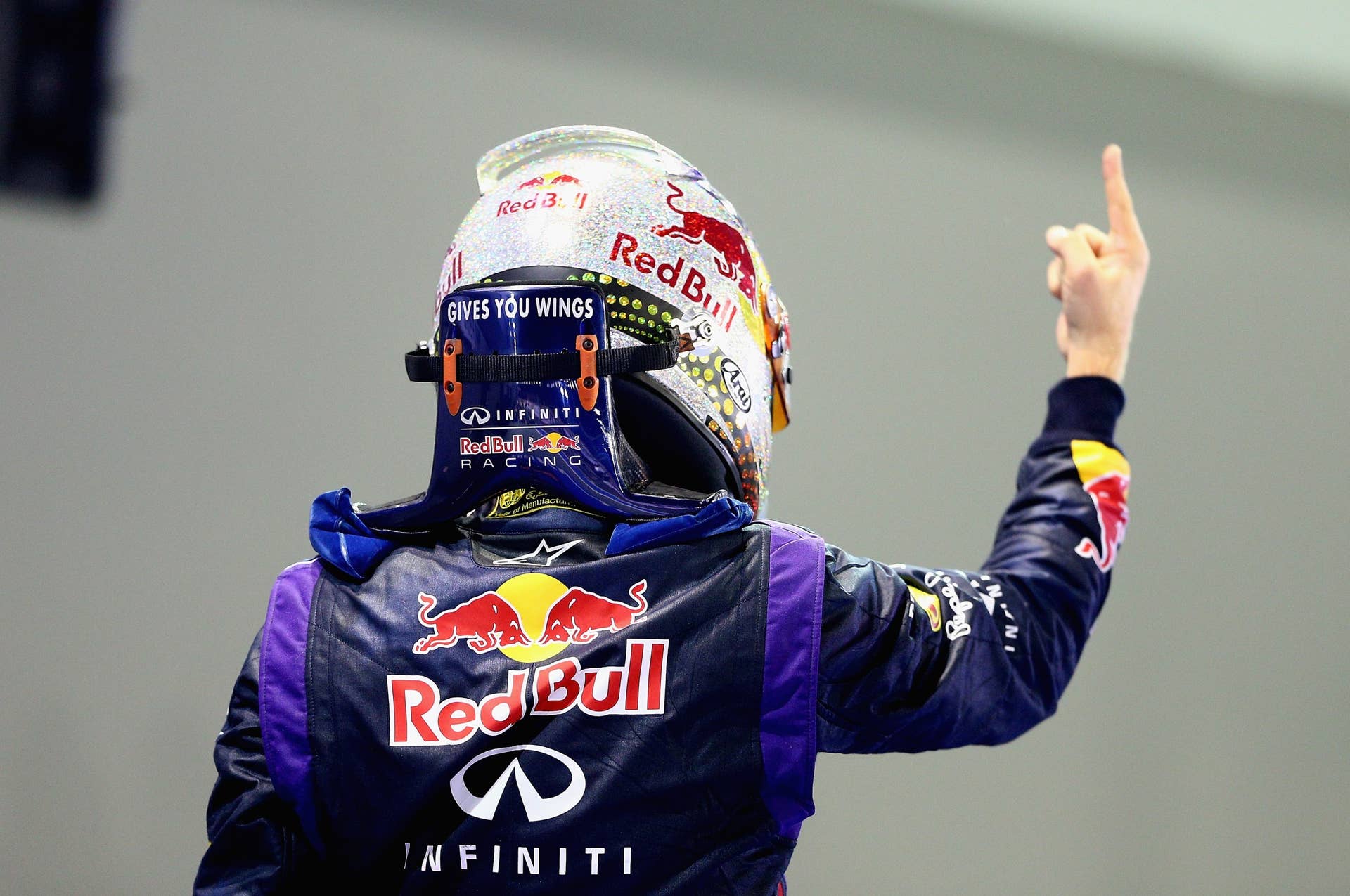 SINGAPORE - SEPTEMBER 22:  Sebastian Vettel of Germany and Infiniti Red Bull racing celebrates following his victory during the Singapore Formula One Grand Prix at Marina Bay Street Circuit on September 22, 2013 in Singapore, Singapore.  (Photo by Clive Mason/Getty Images)
