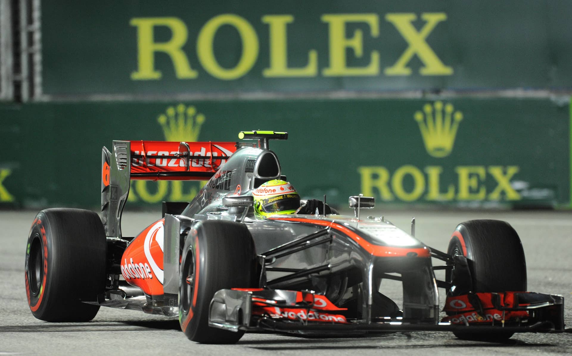 McLaren driver Sergio Perez Mendoza of Mexico drives during the Formula One Singapore Grand Prix on September 22, 2013.     AFP PHOTO / ROSLAN RAHMAN        (Photo credit should read ROSLAN RAHMAN/AFP/Getty Images)