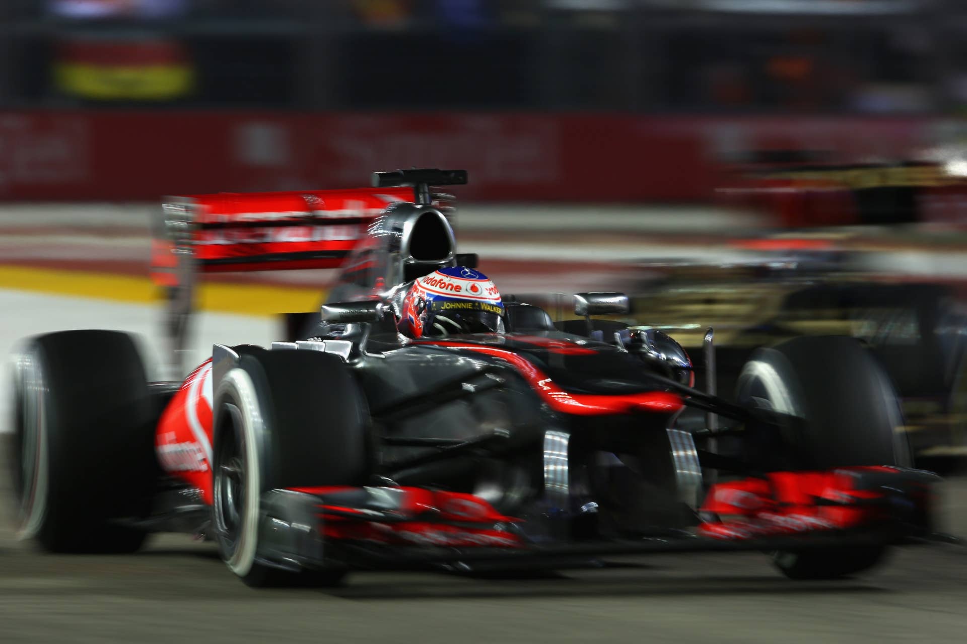 SINGAPORE - SEPTEMBER 22: Jenson Button of Great Britain and McLaren drives during the Singapore Formula One Grand Prix at Marina Bay Street Circuit on September 22, 2013 in Singapore, Singapore.
